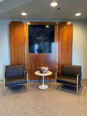 Pan Am Clipper Club Lounge reception panel, wood with brass inlay.