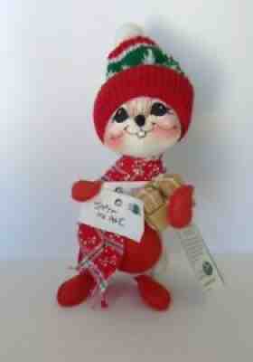 Annalee doll Christmas mailman mouse dressed in red with a snow hat and letter.
