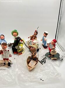 LOT OF 9 ANNALEE DOLLS WITH TAGS AND BAGS INDIAN, BEAR IN A BOAT AND MORE