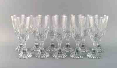 Baccarat, France. 11 Art Deco Assas red wine glassses in crystal glass.