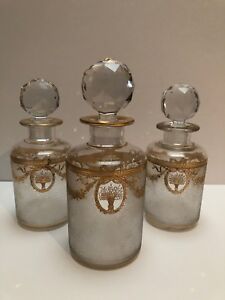 BACCARAT FROSTED PERFUME BOTTLES WITH ELABORATE GOLD GARLANDS AND FLOWERS