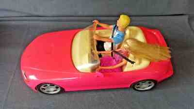 BATTERY OPERATED BARBIE PINK SPORTS CAR CONVERTIBLE WITH BARBIE & KEN DOLLS
