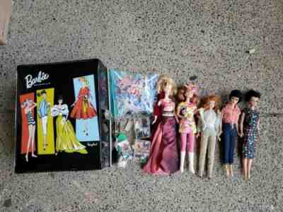 Vintage lot of Barbie's includes 1961 barbie case And accessories