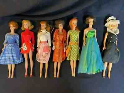 Lot of 7 vintage Mattel 60s era dolls with clothes
