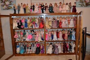 Lot of 243 Displayed Barbies and 3 NIB (Bob Mackie Gold and 2 Coca-Cola Barbies)