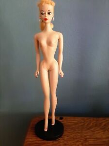 Barbie doll, original 1959, in pristine condition. includes 11 original outfits.