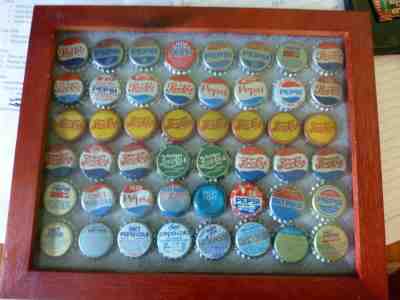 Collection in Display Case of Vintage Pepsi Cola Crowns, 48 Total