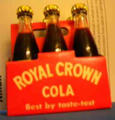 6 vintage 3" Royal Crown Cola, In paper carrier. caps, fluid and intact labelsÂ 