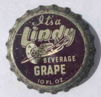 LINDY GRAPE SODA POP BOTTLE CAP; BOONE, IOWA; USED CORK CROWN, airplane