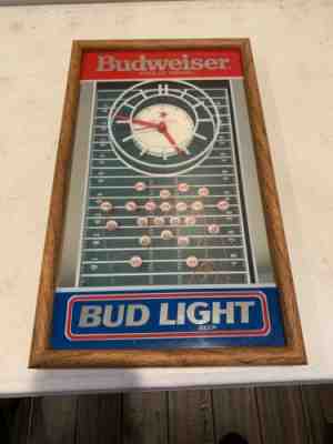 Vintage Budweiser vs. Bud Light NFL Football Clock Mirror Bar Sign