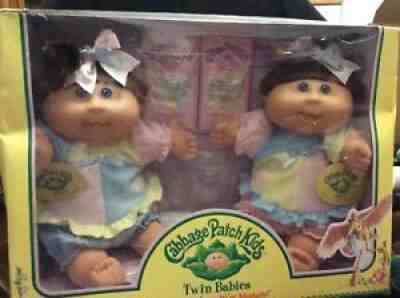 Cabbage Patch Kids Twin Babies, girls, Caucasian with blue eyes and brown hair,