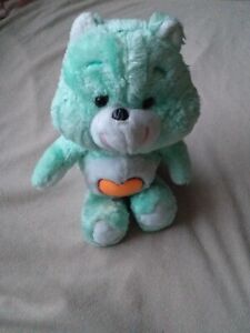 care bear from 80s green, orange heart, Maverick?