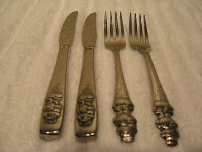 4 PC SET OF ONEIDA STAINLESS IN THE CARE BEAR PATTERN KNIVES & FORKS