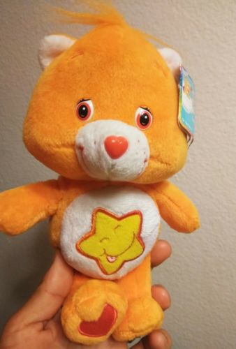 CAREBEAR LAUGH A LOT BEAR  ORANGE WITH YELLOW STAR ***NEW WITH TAGS