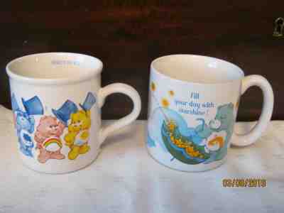 2 VINTAGE CARE BEAR MUGS 1985, "HERE'S TO YOU" & "FILL YOUR DAY WITH STARSHINE"