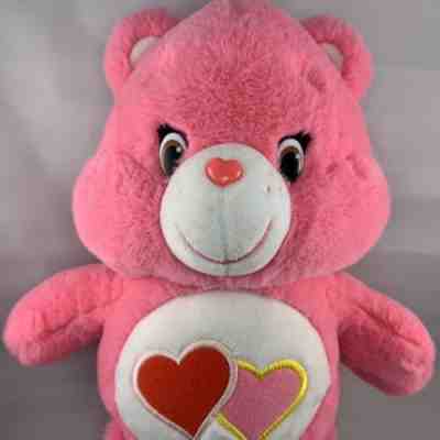 pink care bear with two hearts