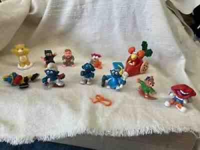 Lot of vintage 1970s 80s Smurfs, Carebear, others. Figurines Rubber plastic