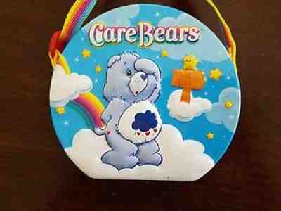 Care Bears Embossed Collector ??s Tin Purse w/ Rainbow Colored Adjustable Strap