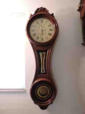 antique walnut figure 8 wall clock E Howard