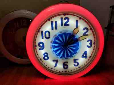 Vintage Neon clock. Electric Neon Clock Company Pinwheel illusion spinner clock