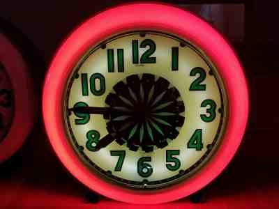 Vintage neon clock. Electric Neon Clock Company Pinwheel illusion spinner clock
