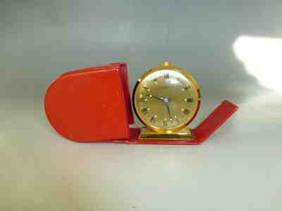 VINTAGE SWISS WIND UP TRAVEL ALARM 8 DAY 15 JEWEL CLOCK WITH RED LEATHER CASE 