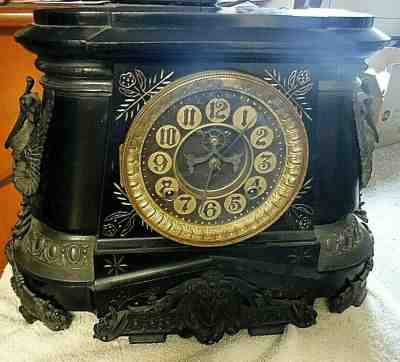 antique black iron  clock fancy ormolu accents open escapement
