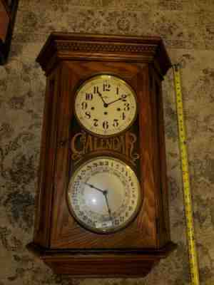 HOWARD MILLER WESTMINSTER CHIME CALENDAR WALL CLOCK WORKS #612-545 DOUBLE DIAL