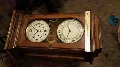 Howard miller wall clock westminster chimes calendar dial with both keys 