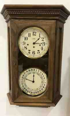 HOWARD MILLER WESTMINSTER CHIME CALENDAR WALL CLOCK WORKS #612-545 DOUBLE DIAL