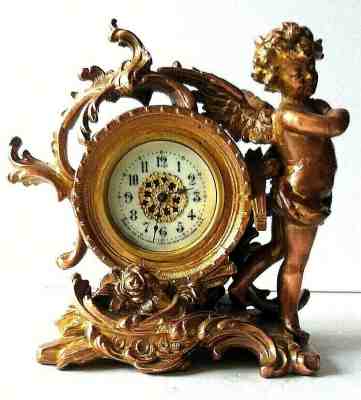 Antique New Haven Gold Tone Cherub antique Table clock made in 19.. years