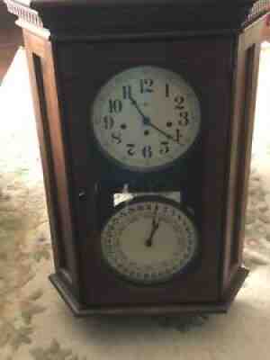 Vintage Howard Miller calendar clock west minister chimes number 10/79