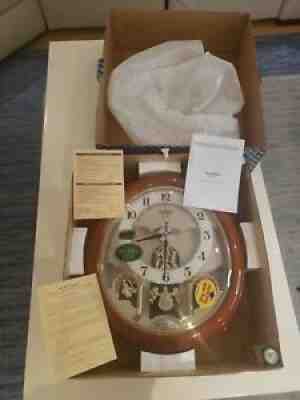 NIB Rhythm Small World Swarovski Crystal Wooden Case Clock