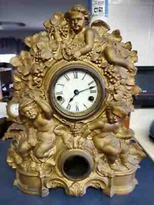 Cast metal front 30 HR time and striker clock American clock co. "gold" cherubs