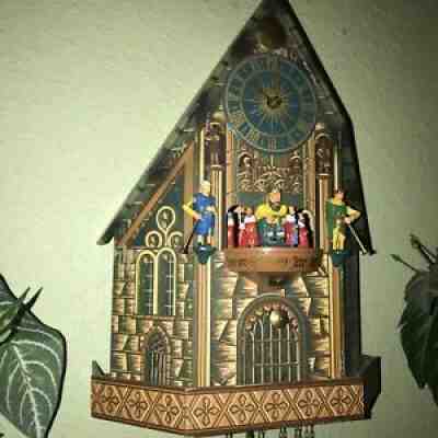 GERMAN ANIMATED TRUMPETERS MUSICAL CUCKOO CHURCH CLOCK WITH ROTATING KNIGHTS
