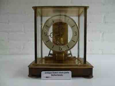 ELECTRONIC PULSE CLOCK MARKED KUNDO GLASS DOME