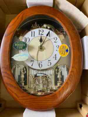 RHYTHM SMALL WORLD WALL CLOCK ANIMATED LIGHTED MUSICAL SWAROVSKI NIB SEE VIDEO