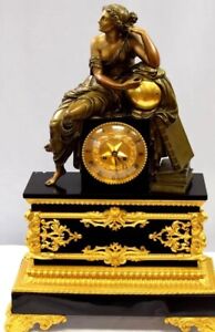 FINE BRONZE, DORE & PATINATED FIGURAL BRONZE & BLACK ONYX CLOCK