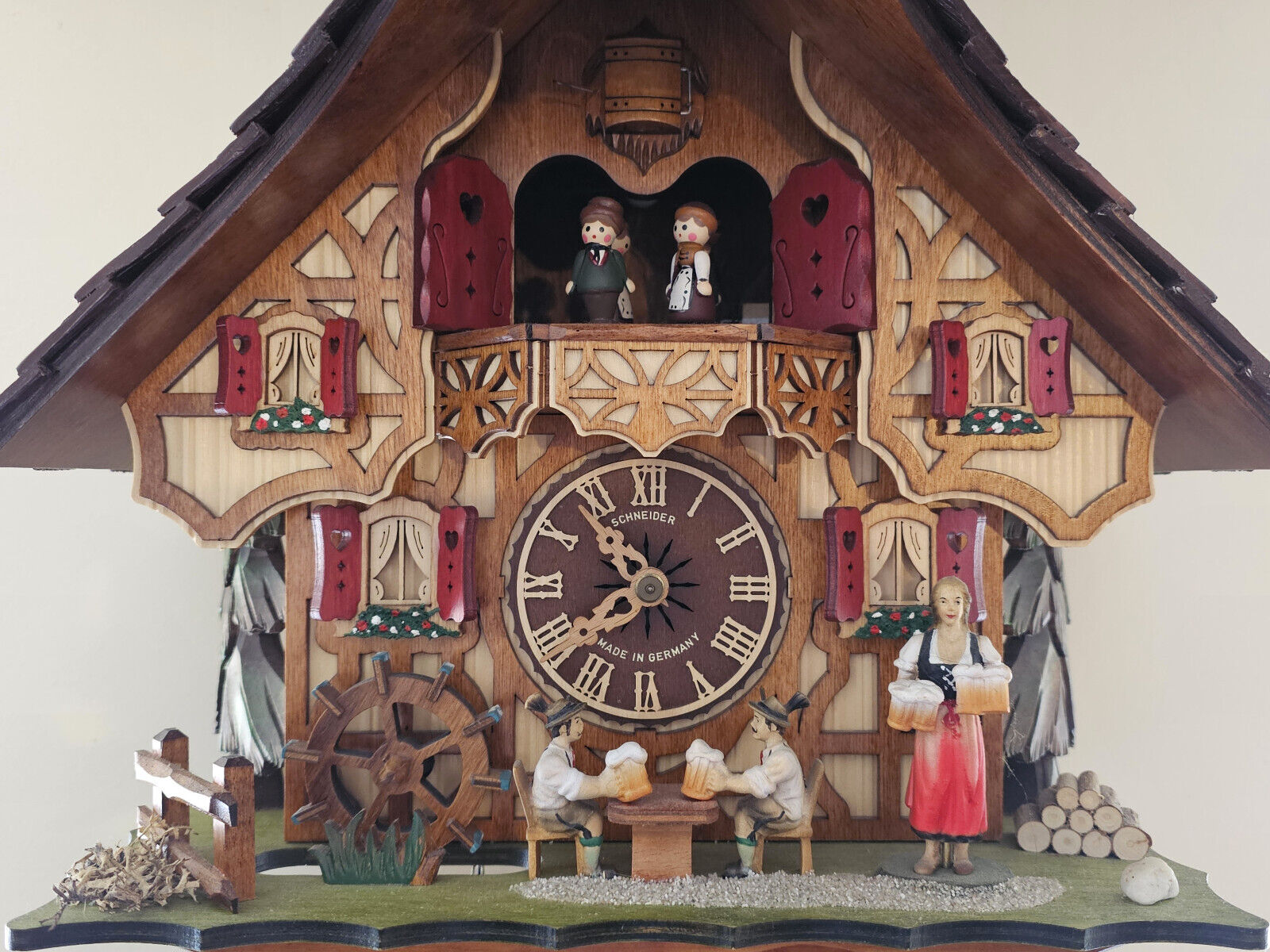 8 day Cuckoo Clock Black Forest house with moving beer drinkers and mill wheel