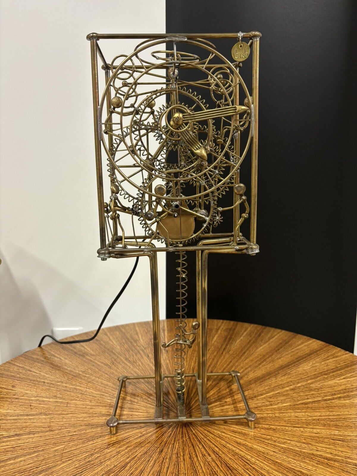 KINETICO STUDIOS  Vintage Brass Clock: ''Seven Man Clock' By Gordon Brandt