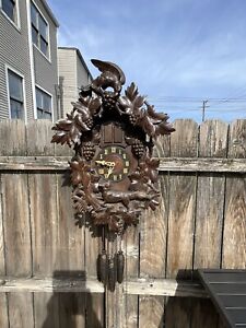 german black forest musical large cuckoo clock , fox & grapes design
