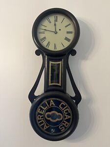 Figure Eight Weight Driven Wall Clock with Aurelia Cigars Ad. Wayne Cline Signed