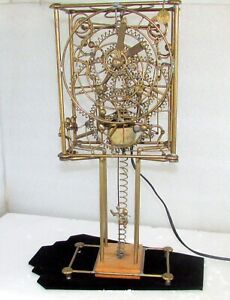 KINETICO STUDIOS GORDON BRADT BRASS 7 MAN SCULPTURE CLOCK