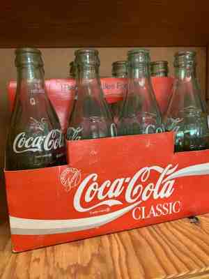 classic green glass coke bottles from 1986, opened but perfect condition! 