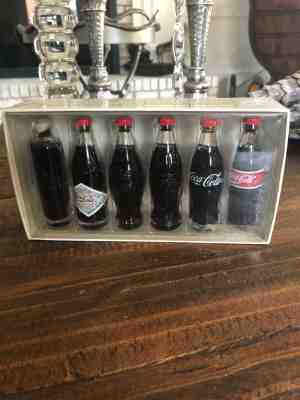 Evolution of the Coca Cola Contour Bottle 6 Piece Miniature Bottle Set in Box