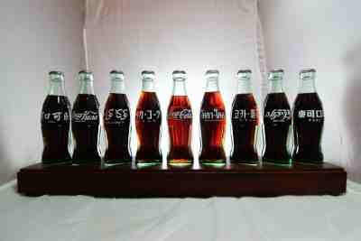 1986 Coca Cola Coke 100th Centennial International Complete 9 Bottle Display Set
