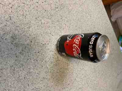 Factory sealed nearly empty coke zero can