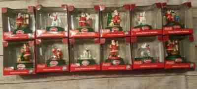 Lot 12 Coca Cola Rotating Ornament/ Centerpiece Polar Bear Santa TESTED ALL WORK