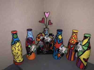 ????Britto Romero Coke Bottles And Hugging Coke Figurine Selling As A Set.