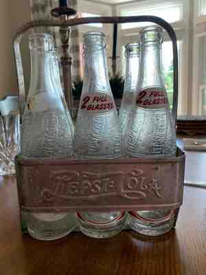 antique pepsi cola bottles with carrier